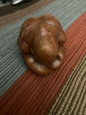 Hand-Carved Weeping Budda Figurine in Warm Brown